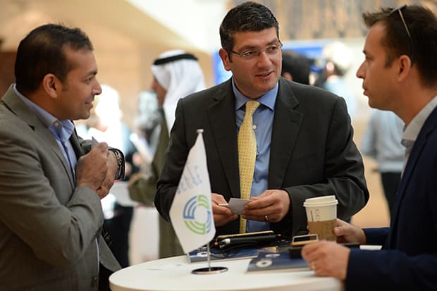 Delegates networking at summit